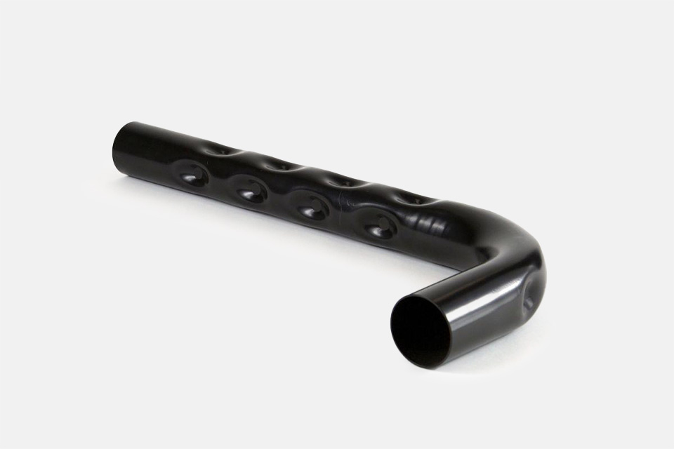 Tube fabricated piece of metal