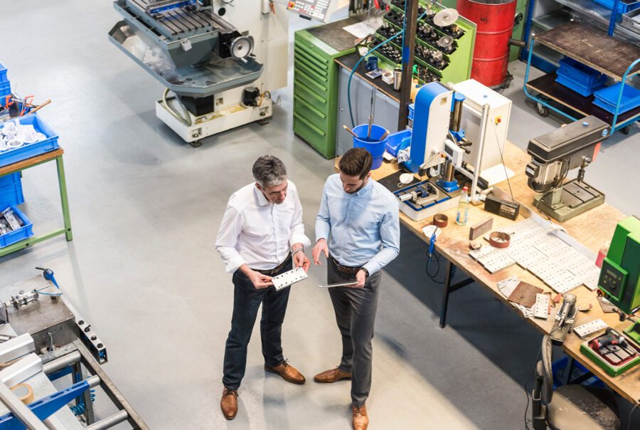 Two people having a discussion in a warehouse