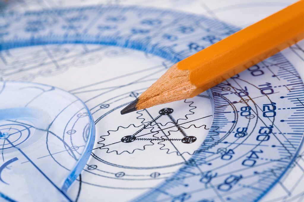 A pencil on top of a blueprint